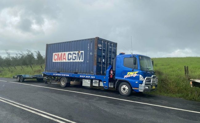 Transporting shipping container on truck - Oz Shipping Containers in coffs harbour
